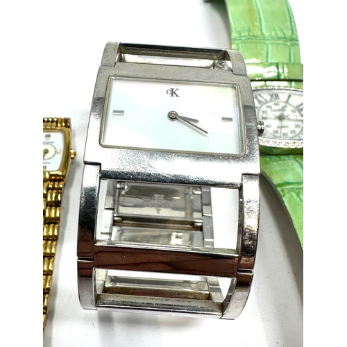 369 - 5 ladies wristwatches quartz includes calvin klein tag heuer dkny movado etc possibly need new batte... 