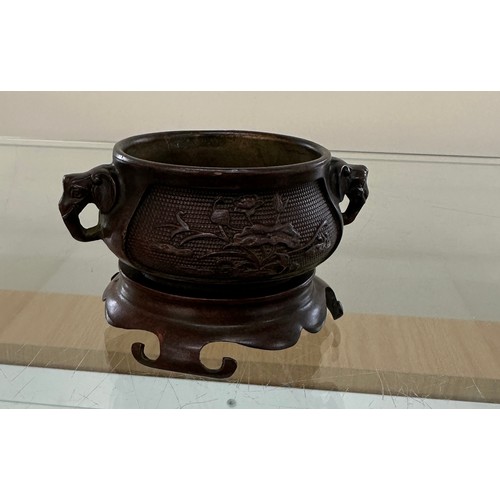 539 - Bronze oriental elephant handled bowl on stand, no marks to base - measures approx 2.5 inches tall b... 