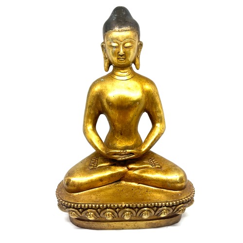 575 - Brass Buddha oriental figure, marks to base height approximately 11 inches tall