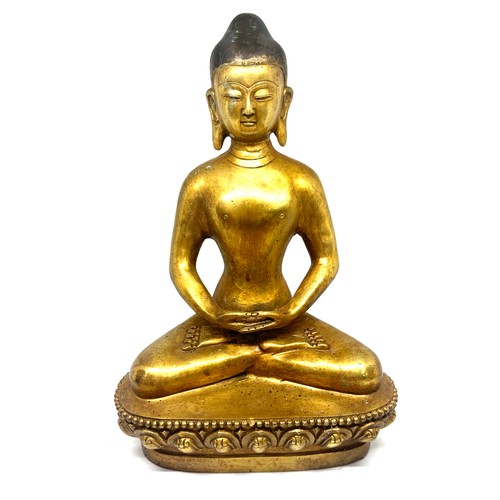 575 - Brass Buddha oriental figure, marks to base height approximately 11 inches tall