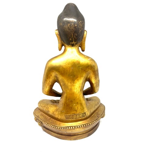 575 - Brass Buddha oriental figure, marks to base height approximately 11 inches tall