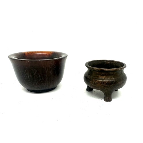 562 - Miniature brass three legged bowl, marks to base and one other