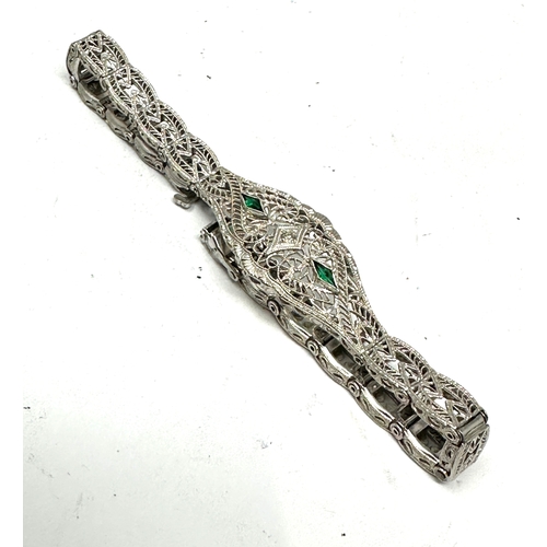 131 - 10ct white gold diamond & diopside bracelet weight 7.1g