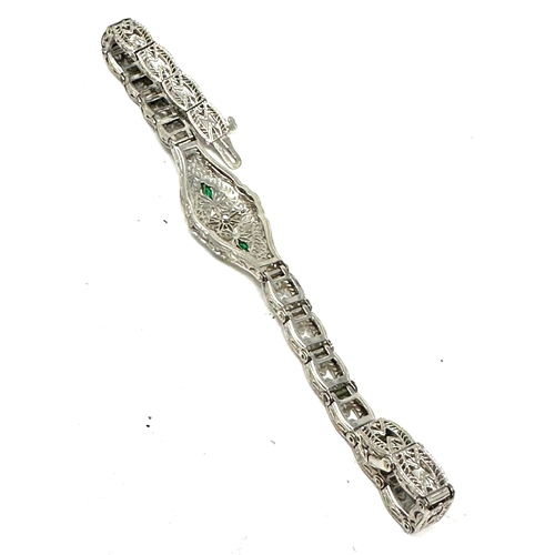 131 - 10ct white gold diamond & diopside bracelet weight 7.1g