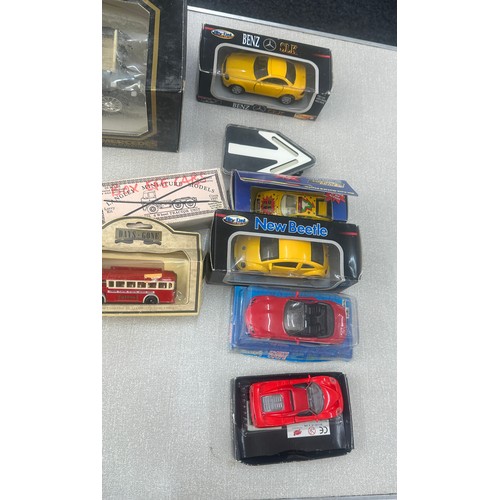 112 - Selection of boxed cars includes Burago etc