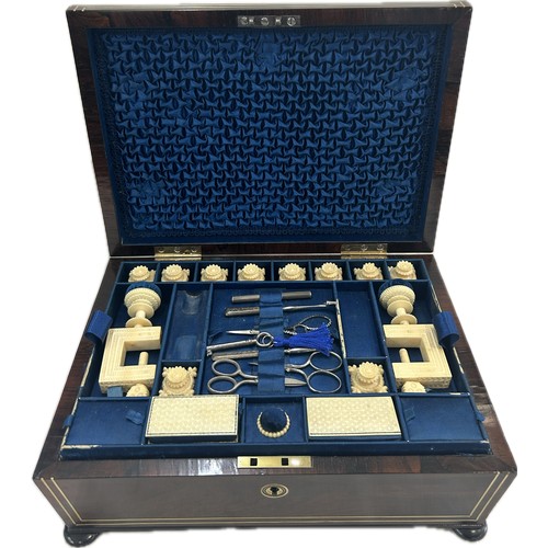 Rosewood sewing box, brass inlay with ivory sewing accessories (Clamps, Bobbins etc) working lock and key, together with Ivory submission