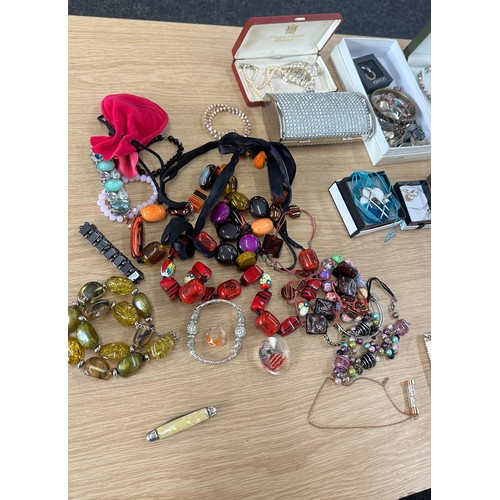 552 - Large selection of assorted costume jewellery includes necklaces, cutlery etc