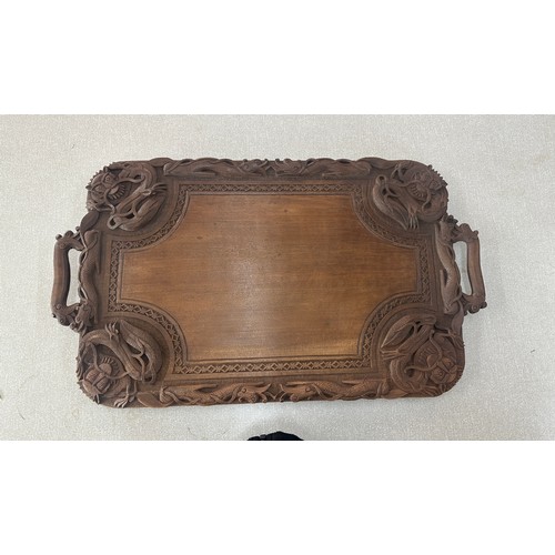 12 - Carved Indonesian tray measures approximately 15 x 26 inches