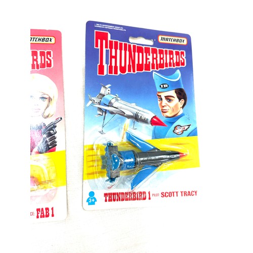 95 - 2 x Thunderbirds 1 pilot Scott Tracy in original packaging, Lady Penelope's car in original packagin... 