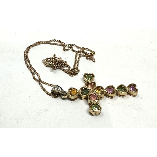 143 - 9ct gold gemstone set  cross necklace weight approx 4.3g