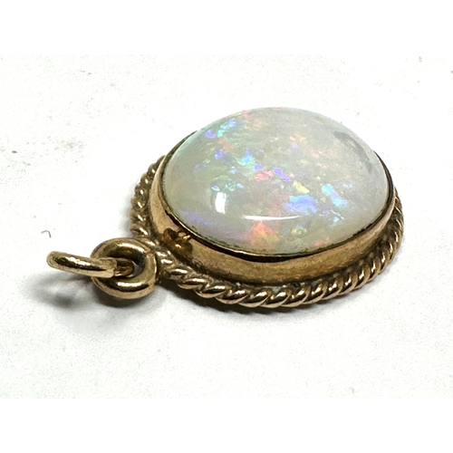 154 - 9ct gold opal pendant opal measures approx 14mm by 11mm weight 2.5g