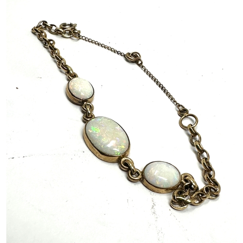 156 - 9ct gold opal bracelet weight the 15mm by 11nn largest opal measure approx 6.9g