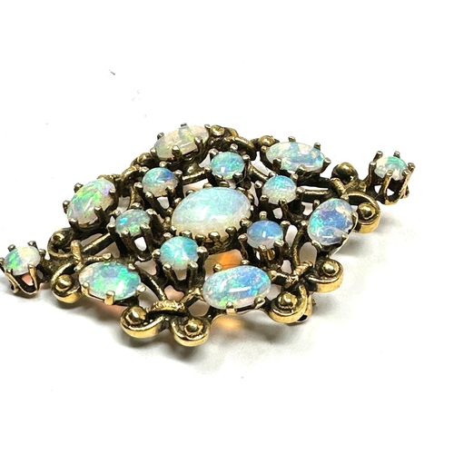 157 - fine 14ct gold opal pendant /brooch measures approx 4cm by 2.7cm weight 8.2g