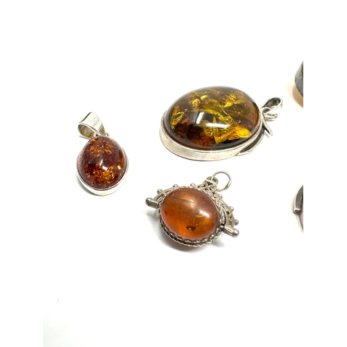 288 - selection of silver & amber pendants & brooch & small swivel fob weight 43g