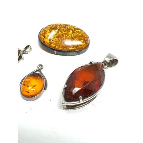 288 - selection of silver & amber pendants & brooch & small swivel fob weight 43g