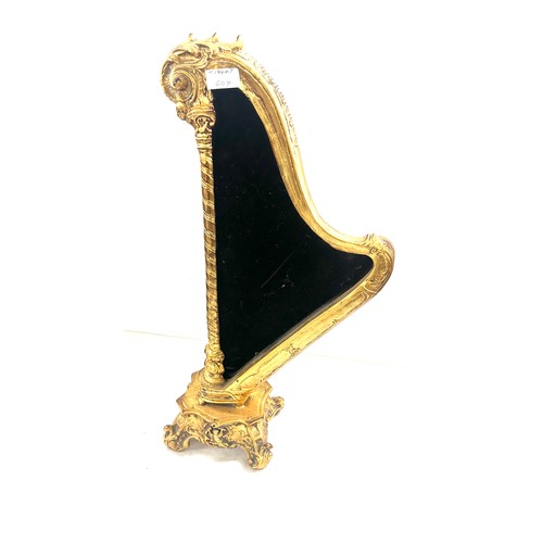 75 - Gilt harp shaped cherub table mirror, overall height 24 inches