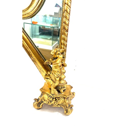 75 - Gilt harp shaped cherub table mirror, overall height 24 inches