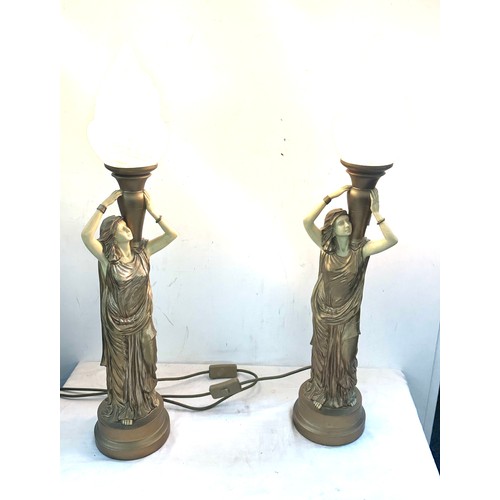 85 - Pair gold lady with flame shaped table lamps, working order, overall height 28 inches