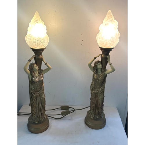 85 - Pair gold lady with flame shaped table lamps, working order, overall height 28 inches