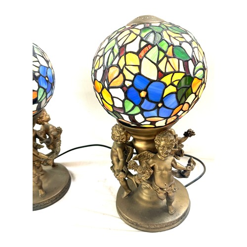 96 - Cherub base lamps, with sphere glass shades, working order, overall height 17 inches