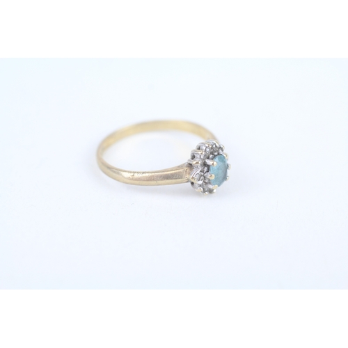 239 - 9ct gold oval cut blue topaz & diamond cluster ring, claw set