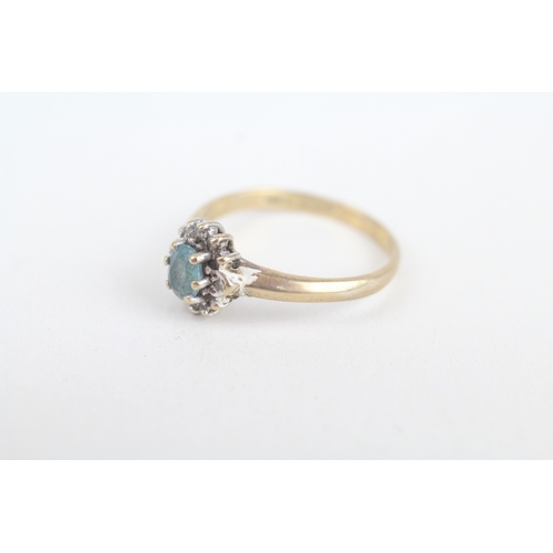 239 - 9ct gold oval cut blue topaz & diamond cluster ring, claw set