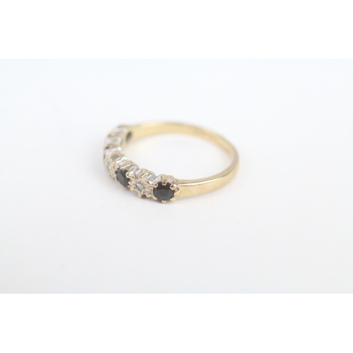 242 - 9ct gold sapphire & diamond half eternity ring