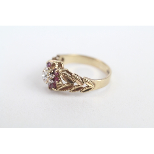 243 - 9ct gold vintage ruby & diamond cluster ring with foliate patterned shoulders (as seen)