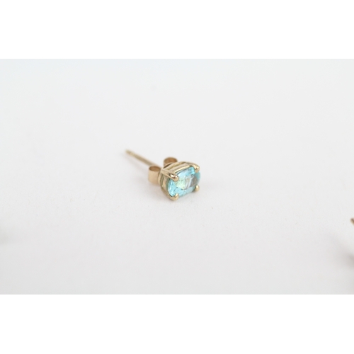 249 - 2 x 9ct gold blue gemstone and topaz stud earrings