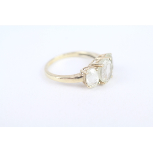 252 - 9ct gold white spodumene three stone ring