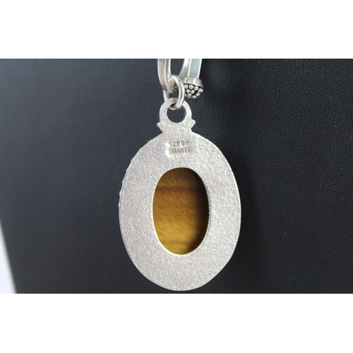 305 - A silver tigerseye pendant necklace by Suarti (51g)