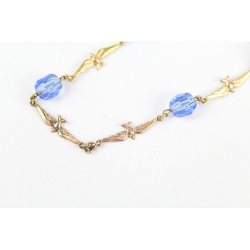 255 - 9ct gold faceted blue glass & flying birds necklace