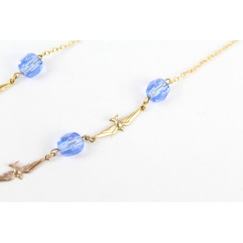 255 - 9ct gold faceted blue glass & flying birds necklace