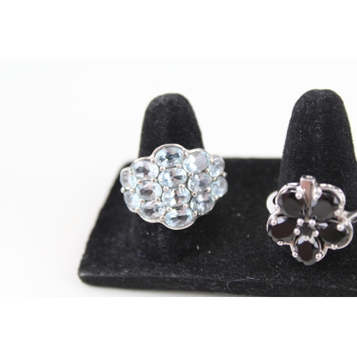 316 - Eight silver stone set rings including topaz and diamond (28g)