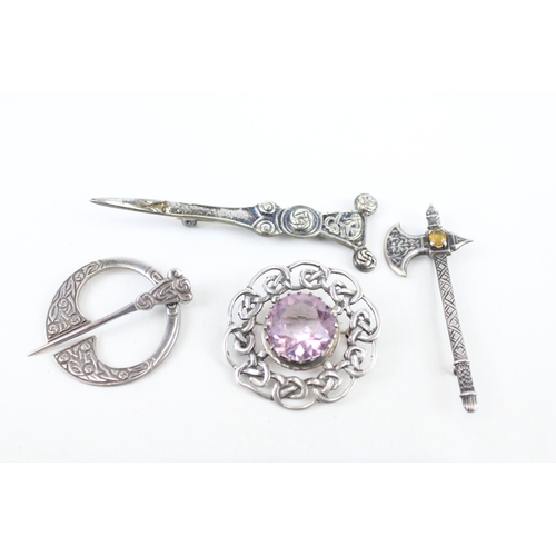 323 - Four Scottish silver brooches including a penannular (46g)