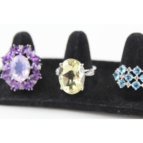 325 - Eight silver stone set rings including amethyst and topaz (39g)