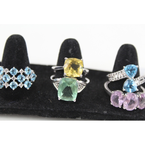 325 - Eight silver stone set rings including amethyst and topaz (39g)