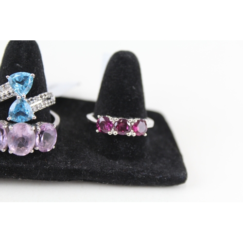 325 - Eight silver stone set rings including amethyst and topaz (39g)