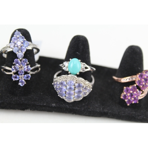 326 - Eight silver stone set rings including tanzanite and opal (33g)