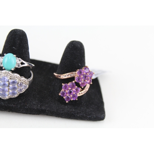 326 - Eight silver stone set rings including tanzanite and opal (33g)