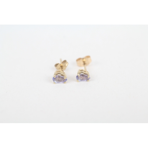 206 - 2 x 9ct gold sapphire and tanzanite set stud earrings