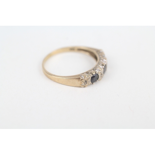 215 - 9ct gold sapphire three stone ring with diamond accent