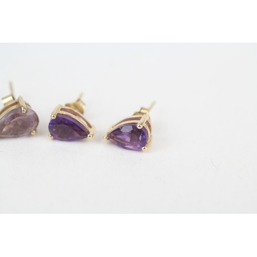 232 - 2x 9ct gold pear cut amethyst stud earrings with scroll backs