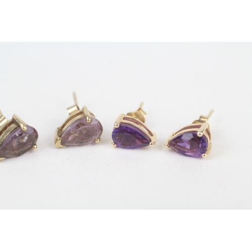 232 - 2x 9ct gold pear cut amethyst stud earrings with scroll backs