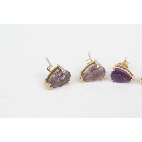 232 - 2x 9ct gold pear cut amethyst stud earrings with scroll backs