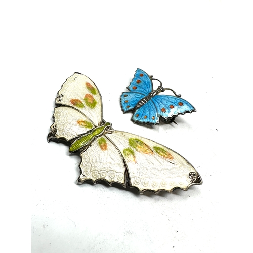 302 - 2 antique silver & enamel butterfly brooches largest measures approx 6.5cm edge enamel wear the smal... 