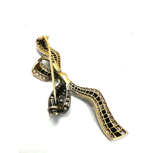 171 - Fine antique art deco gold & diamond and black gemstone brooch measures approx 6cm wide by 2.5cm hig... 