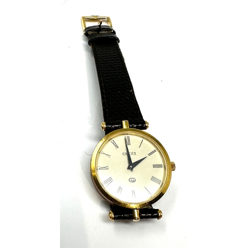 386 - Vintage Gucci Quartz Swiss Made WristWatch With Gucci Black Leather Band the watch is not ticking pr... 