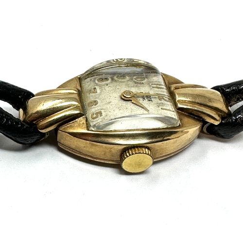 388 - Vintage 9ct gold ladies rolex tudor wristwatch with black leather strap the watch winds and ticks