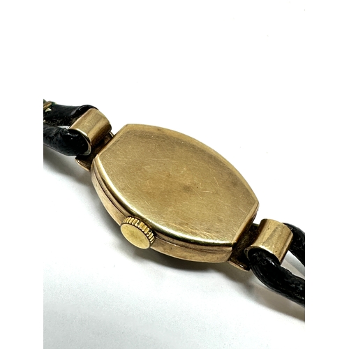 388 - Vintage 9ct gold ladies rolex tudor wristwatch with black leather strap the watch winds and ticks